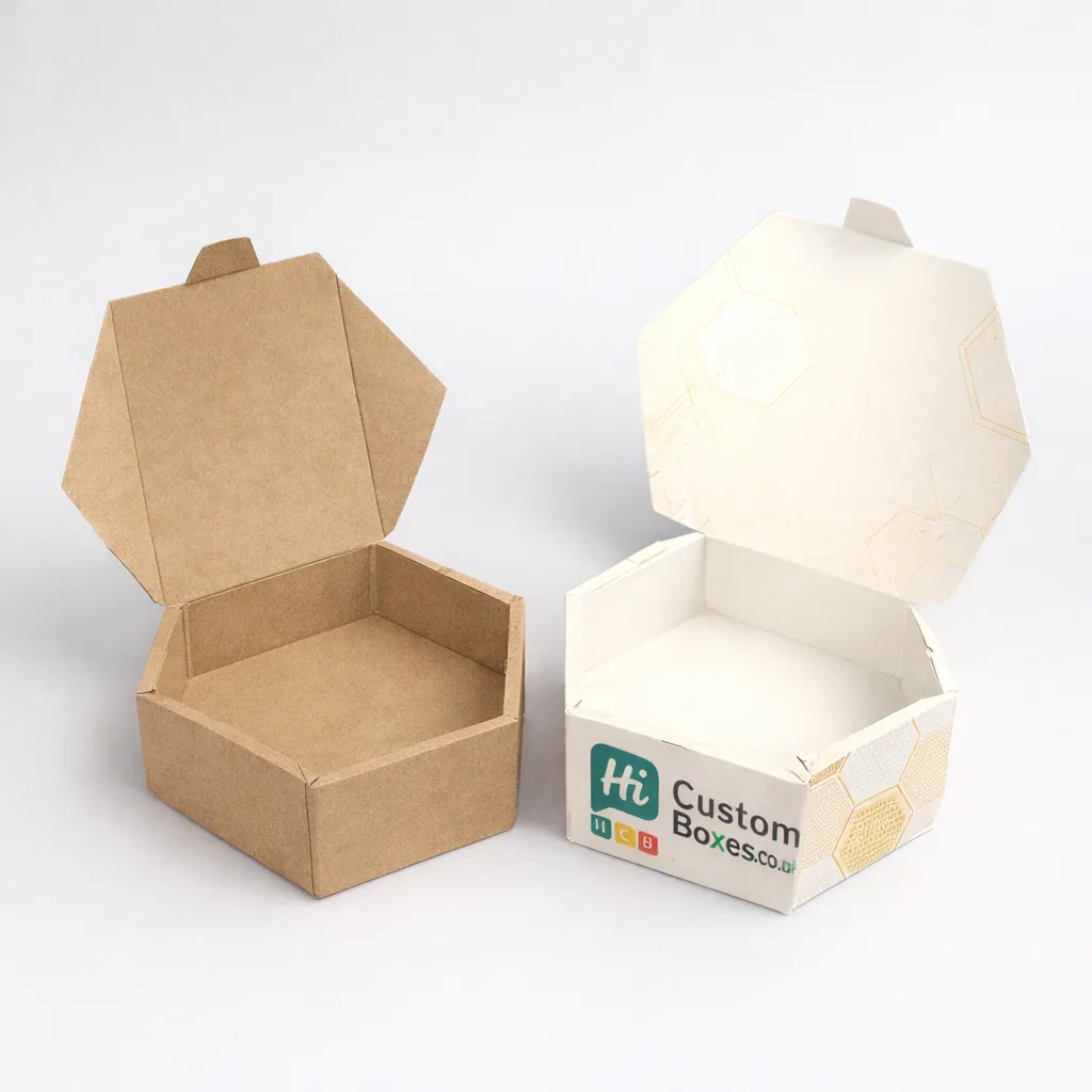 Two open hexagonal cardboard containers, one natural brown and one bespoke white with a honeycomb pattern. class=